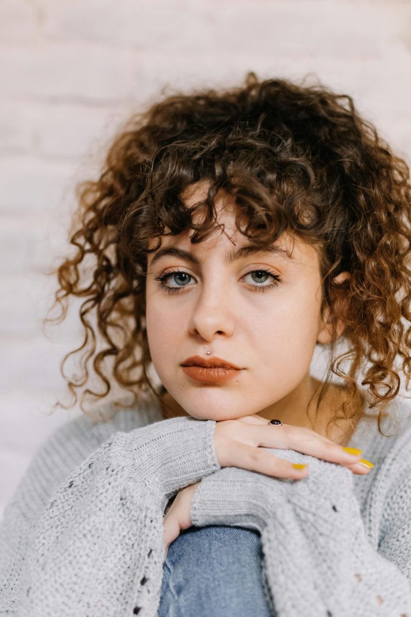 young woman looking hopefully at the camera